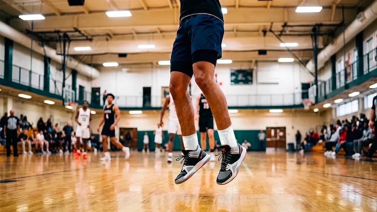 Basketball player jumping during a game, a common moment where ankle sprains occur